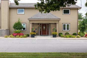 The exterior view of the clubhouse at Wilshire offers a comfortable space for residents to gather and relax.